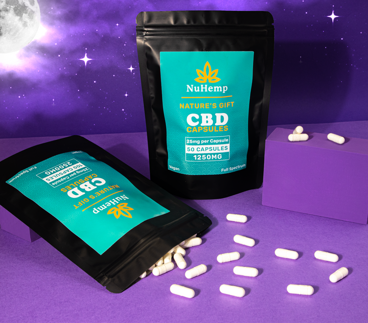 high strength cbd capsules in purple set with the moon and stars