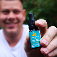 man holding strong cbd oil 3000mg
