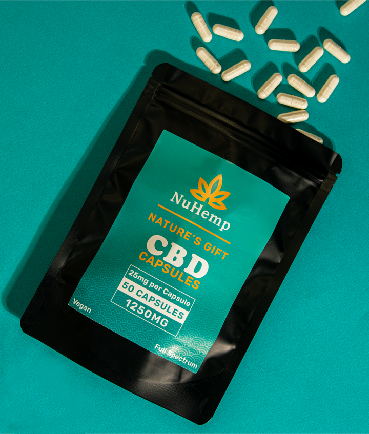 overview of cbd capsules bag with cbd capsules coming out