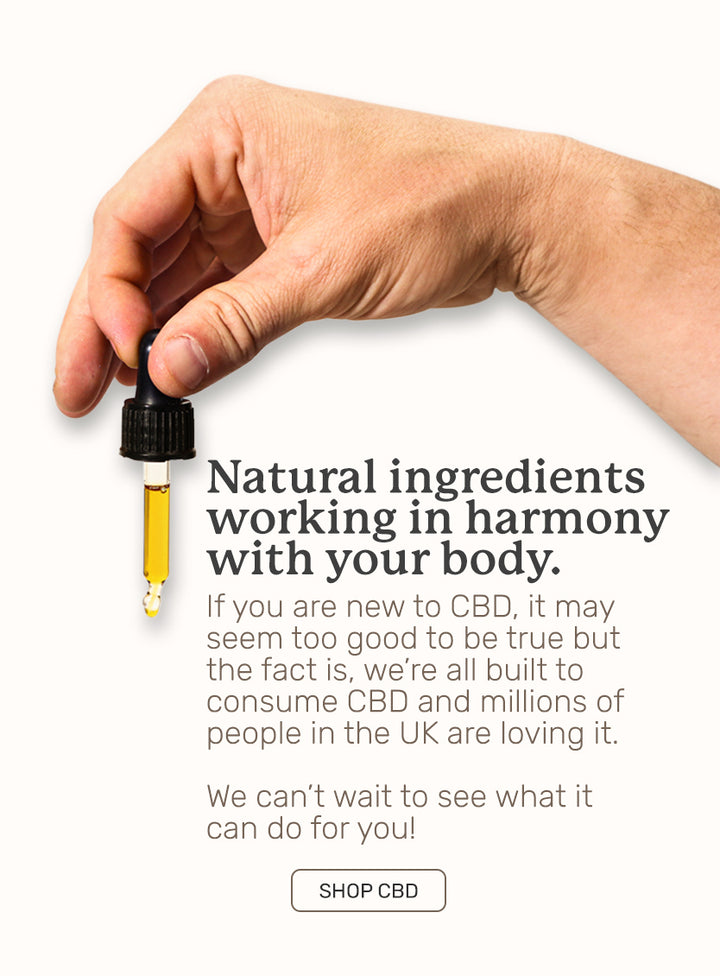 hand holding cbd oil pipette 